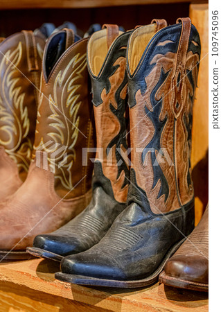 Row of cowboy boots on shelf. Row of cowboy boots on shelf. 109745096