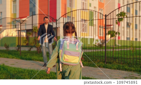 father, recess, kid, parent, girl running from class, happy girl runs into her father arms, smile teeth, father daughter spins, child school backpack runs across school yard, flying air, daughter 109745891
