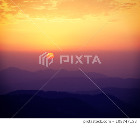 Sunset in hills 109747158