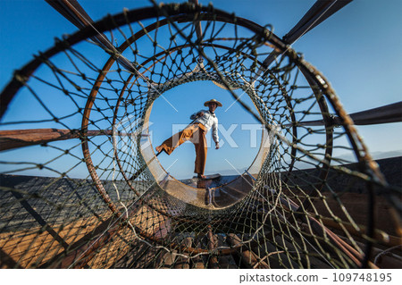 Burmese fisherman at Inle lake, Myanmar Burmese fisherman at Inle lake, Myanmar 109748195