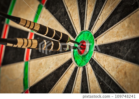 Three darts in bull's eye close up 109748241