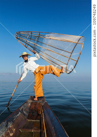 Traditional Burmese fisherman in Myanmar Traditional Burmese fisherman in Myanmar 109748249