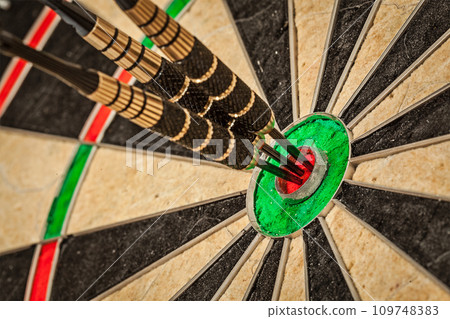 Three darts in bull's eye close up 109748383