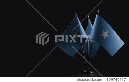 Small national flags of the Somalia on a black background 109749537