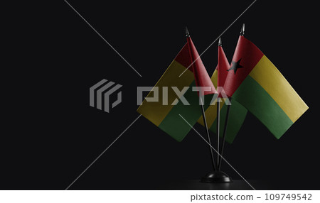 Small national flags of the Guinea Bissau on a black background 109749542