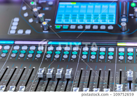 There is an audio system volume control panel, sound mixer equalizer, console 109752659