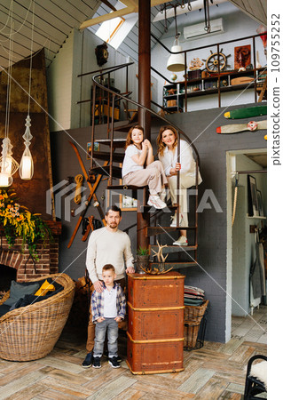 Happy family with two children in their home.  109755252