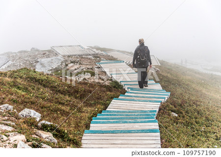 Clouds and fog over Gulf St. Lawrence from boardwalk Skyline Trail in Cape Breton Highlands National Park, Nova Scotia 109757190