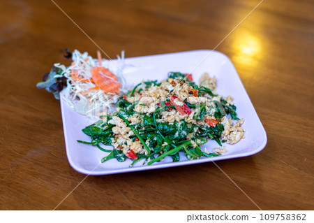 Fried gurmar leaf with egg 109758362