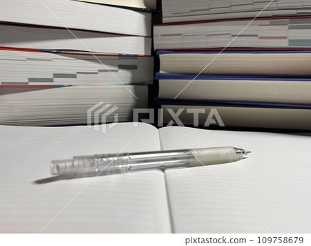 Books piled up to study for entrance exams Books piled up to study for entrance exams 109758679