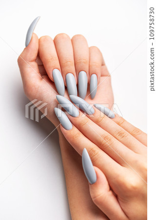 Woman's hand with grey nail polish Woman's hand with grey nail polish 109758730