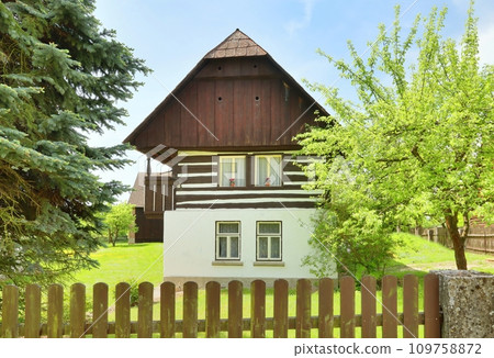 Traditional wooden cottage in central Europe Traditional wooden cottage in central Europe 109758872