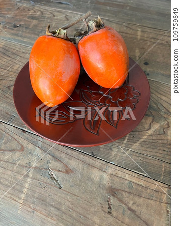 A landscape with persimmons, a landscape with ripe persimmons A landscape with persimmons, a landscape with ripe persimmons 109759849