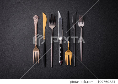 Kitchen knife and fork made of steel with copy space Kitchen knife and fork made of steel with copy space 109760283
