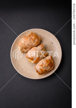 Delicious fresh meat roll made from chicken fillet, mushrooms, spices and herbs 109760316
