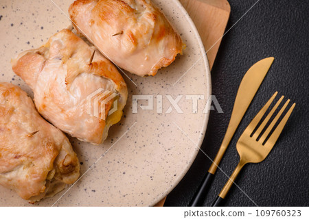 Delicious fresh meat roll made from chicken fillet, mushrooms, spices and herbs 109760323
