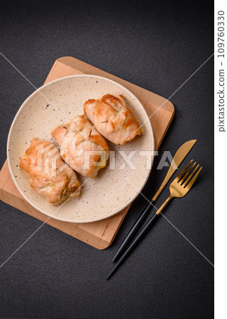 Delicious fresh meat roll made from chicken fillet, mushrooms, spices and herbs Delicious fresh meat roll made from chicken fillet, mushrooms, spices and herbs 109760330