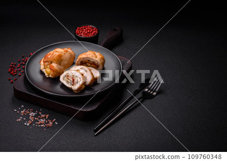 Delicious fresh meat roll made from chicken fillet, mushrooms, spices and herbs 109760348