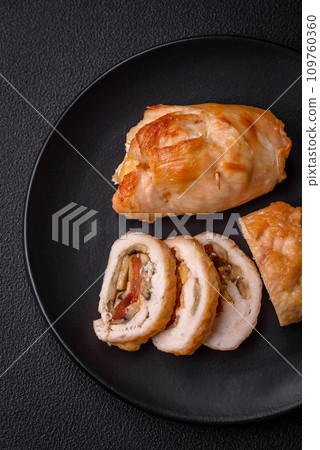 Delicious fresh meat roll made from chicken fillet, mushrooms, spices and herbs Delicious fresh meat roll made from chicken fillet, mushrooms, spices and herbs 109760360