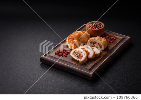 Delicious fresh meat roll made from chicken fillet, mushrooms, spices and herbs 109760366