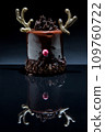Chocolate reindeer cake with brown cream frosting decorated with antlers on the black background. Merry Christmas and Happy New Year festive concept 109760722