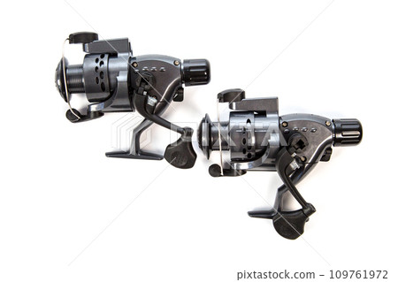Fishing gear - reel for fishing rod, isolated white background 109761972