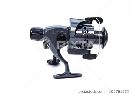 Fishing gear - reel for fishing rod, isolated white background Fishing gear - reel for fishing rod, isolated white background 109761973