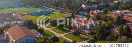 Aerial view of UCLA's campus, blending traditional and modern architecture, with a prominent stadium, greenery, and clear skies, conveying a serene academic atmosphere. Aerial view of UCLA's campus, blending traditional and modern architecture, with a prominent stadium, greenery, and clear skies, conveying a serene academic atmosphere. 109763322