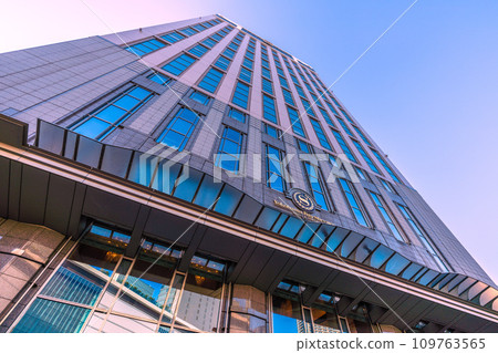 Yokohama cityscape in Japan December. View of Bay Sheraton H in front of Yokohama Station and Yokohama Station reflected in the window glass. Yokohama cityscape in Japan December. View of Bay Sheraton H in front of Yokohama Station and Yokohama Station reflected in the window glass. 109763565
