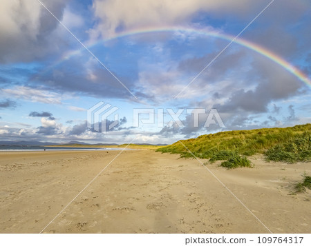 Beautiful rainbow at Portnoo Narin beach in County Donegal - Ireland 109764317