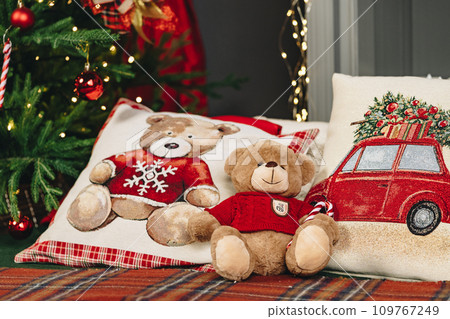 Teddy bear on bed with pillows for Christmas decoration 109767249