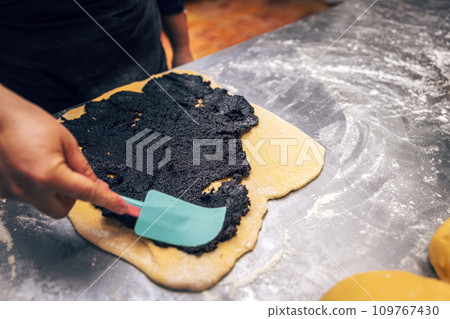 Sweet dough covered with poppy seeds. Sweet dough covered with poppy seeds. 109767430