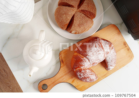 Freshly baked croissant in a kitchen close up 109767504