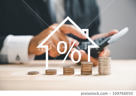 Pressing calculators, hand plans house refinance. Buy or rent, wooden house model on desk. Save for buying home concept, mortgage payment strategy. Tax, credit analysis for wise investment decision. Pressing calculators, hand plans house refinance. Buy or rent, wooden house model on desk. Save for buying home concept, mortgage payment strategy. Tax, credit analysis for wise investment decision. 109768050