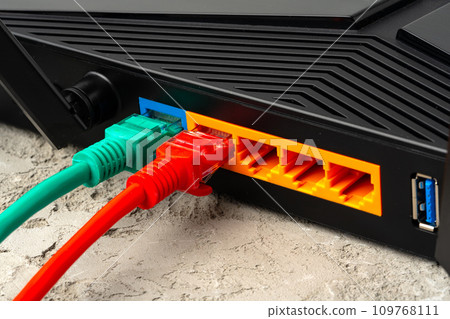 Colored network cable patch-cord on gray textured background Colored network cable patch-cord on gray textured background 109768111