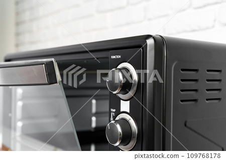 Close up of black mini electric oven home appliance 109768178