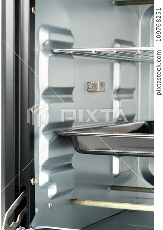 Inside of empty mini electric stove oven Inside of empty mini electric stove oven 109768251