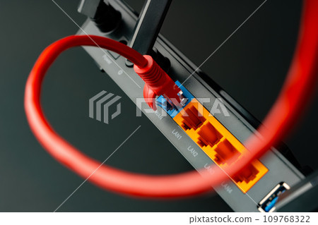 Modern router with cables plugged in close up 109768322
