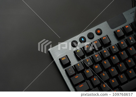 Close up of computer keyboard on black background Close up of computer keyboard on black background 109768657