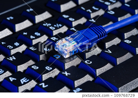 Modern technology network cable in neon light. 109768729
