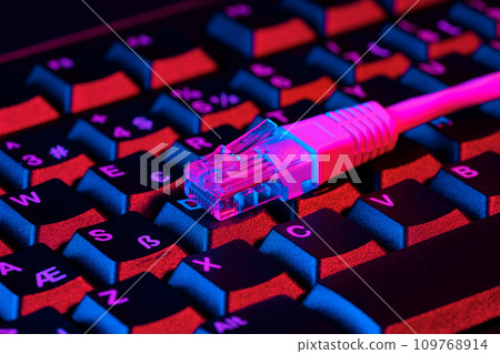 Modern technology network cable in neon light. 109768914