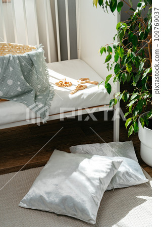 Nursery interior and bedding for kids with wicker bassinet Nursery interior and bedding for kids with wicker bassinet 109769037