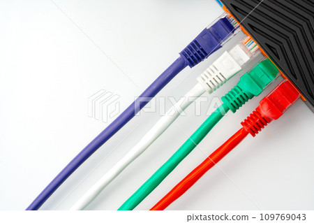 Modern router with cables plugged in close up Modern router with cables plugged in close up 109769043