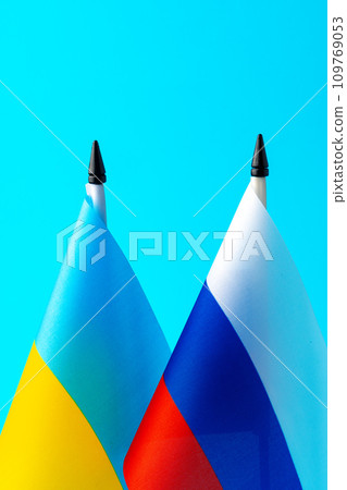Small flags of Russia and Ukraine on flagpoles 109769053