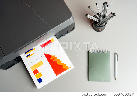 Printer with paper on gray background close up 109769337