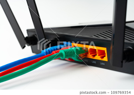 Modern router with cables plugged in close up 109769354