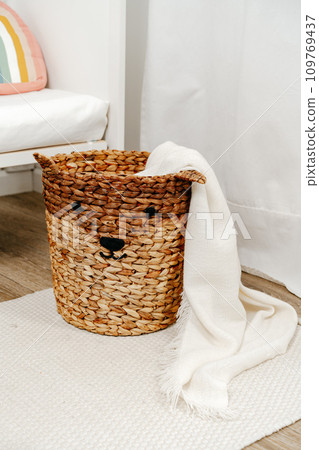 Wicker basket for toys in the children's room 109769437