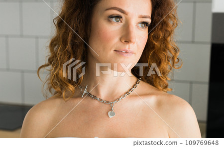 Close-up Female with silver pendant heart close-up. Image for e-commerce, online selling, social media, jewelry sale. Handmade jewelry Close-up Female with silver pendant heart close-up. Image for e-commerce, online selling, social media, jewelry sale. Handmade jewelry 109769648