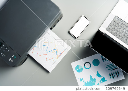 New modern printer and laptop in the office on table New modern printer and laptop in the office on table 109769649