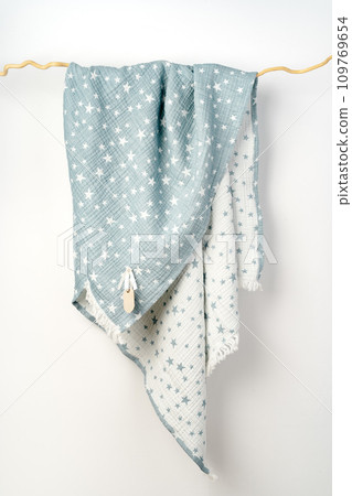 Muslin baby blanket on white background studio shot Muslin baby blanket on white background studio shot 109769654